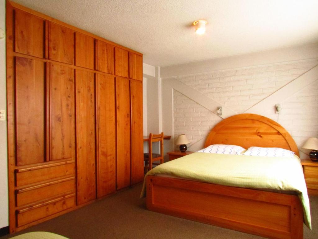 Postel nebo postele na pokoji v ubytování Apartamentos Los Quipus