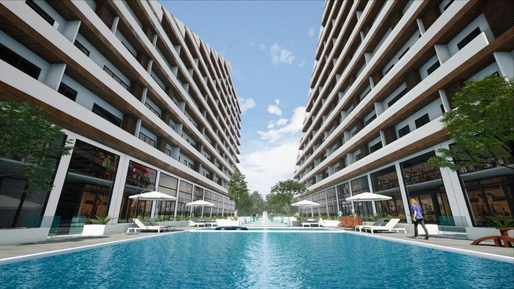 a swimming pool in the middle of a building at Piano and Gold at The Signature, Tetteh Quarshie in Accra