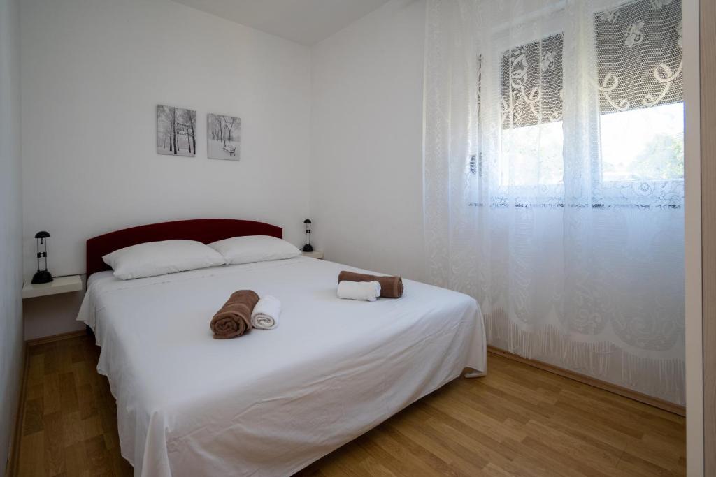Posteľ alebo postele v izbe v ubytovaní Apartments with a parking space Sali, Dugi otok - 16324