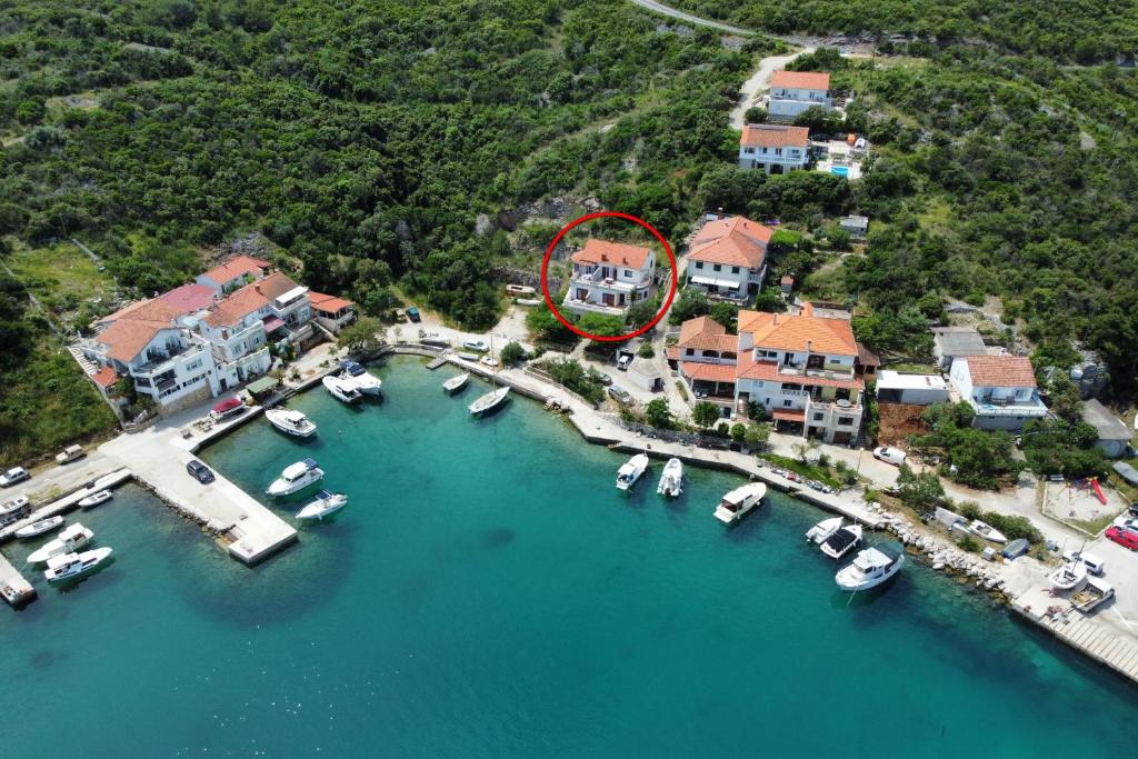 an aerial view of a marina with boats in the water at Apartments by the sea Zaglav, Dugi otok - 17788 in Sali