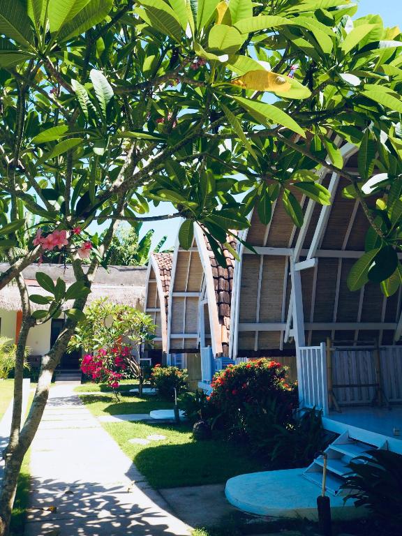 Um jardim no exterior de Dream CoWork Hotel