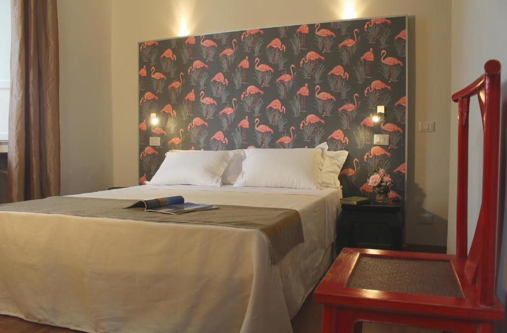 Llit o llits en una habitació de Lucca in Villa Lucrezia