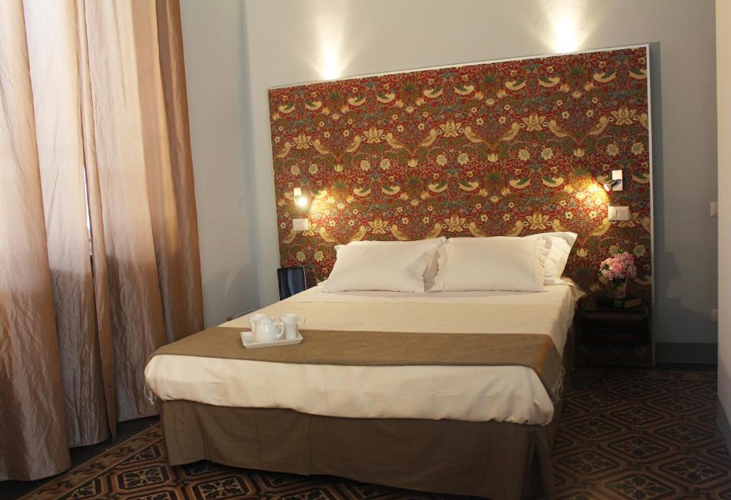 Llit o llits en una habitació de Lucca in Villa Lucrezia