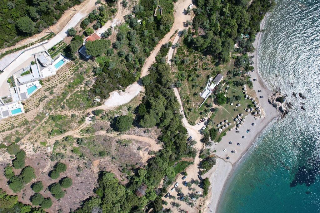 an aerial view of a beach and the ocean at Kechria Bay Villas in Skiathos