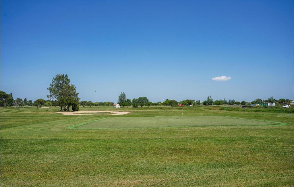 a view of the green at the golf course at 2 Bedroom Beautiful Home In La Faute-sur-mer in La Faute-sur-Mer
