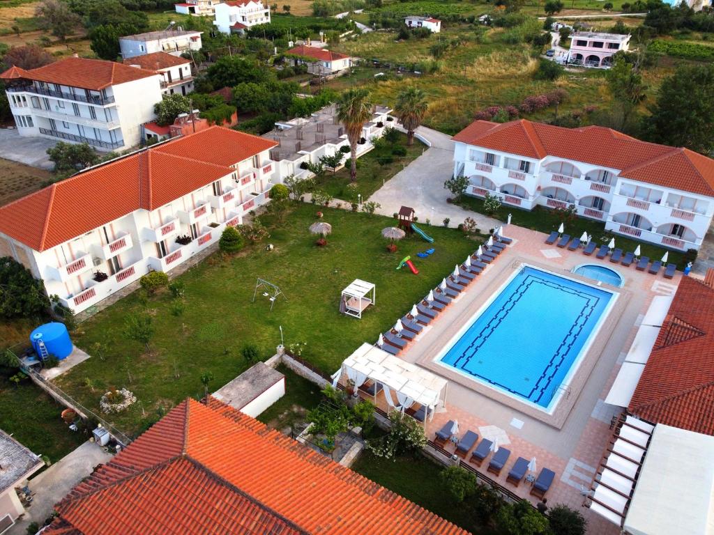 an aerial view of a house with a swimming pool at Akis Studios Alykes in Alykes
