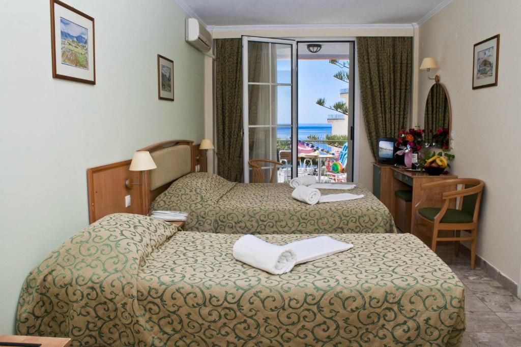 Postel nebo postele na pokoji v ubytování Tolon Holidays Hotel