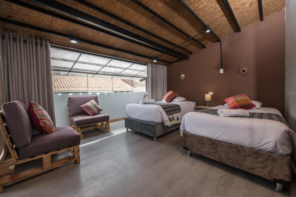Postel nebo postele na pokoji v ubytování Casa Cavassa Centro Histórico Cusco