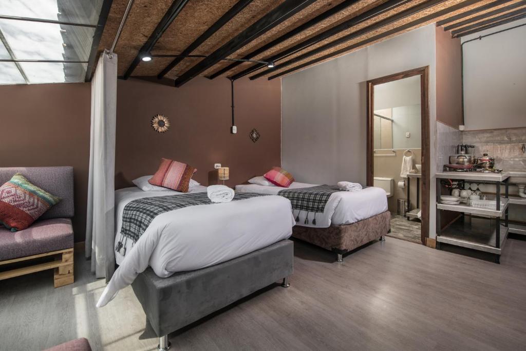 Postel nebo postele na pokoji v ubytování Casa Cavassa Centro Histórico Cusco