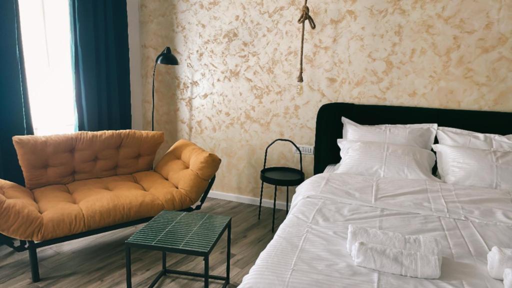 Postel nebo postele na pokoji v ubytování Tomis’ Dreams