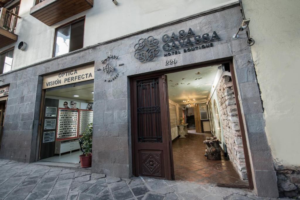 a store front of a building with a door at Casa Cavassa Centro Histórico Cusco in Cusco