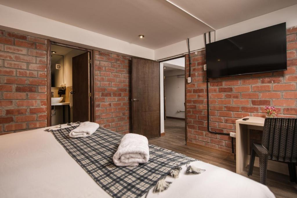 Postel nebo postele na pokoji v ubytování Casa Cavassa Centro Histórico Cusco