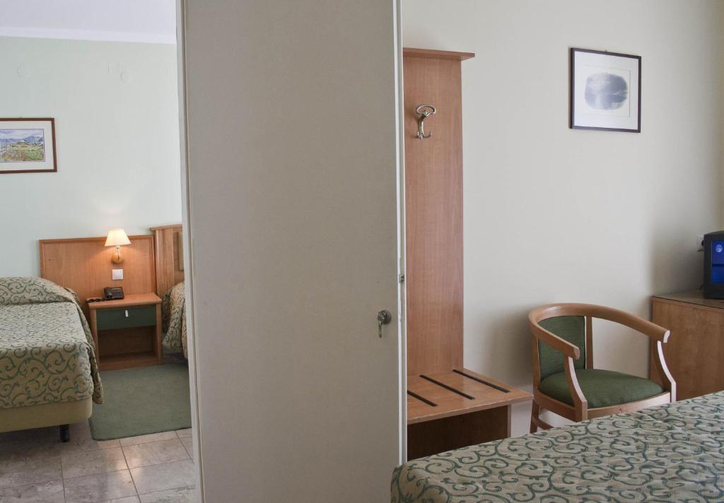 Postel nebo postele na pokoji v ubytování Tolon Holidays Hotel