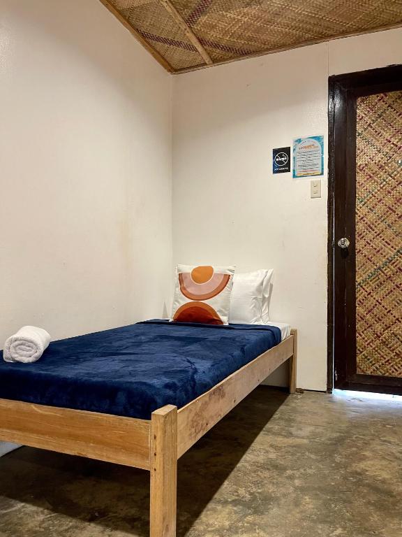 Postel nebo postele na pokoji v ubytování Dawn Patrol Siargao