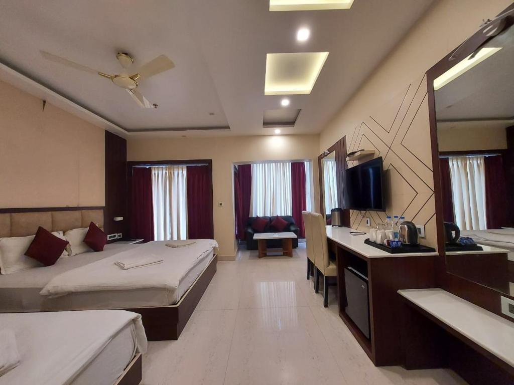 Postel nebo postele na pokoji v ubytování New Gitanjali Hotel, New Digha