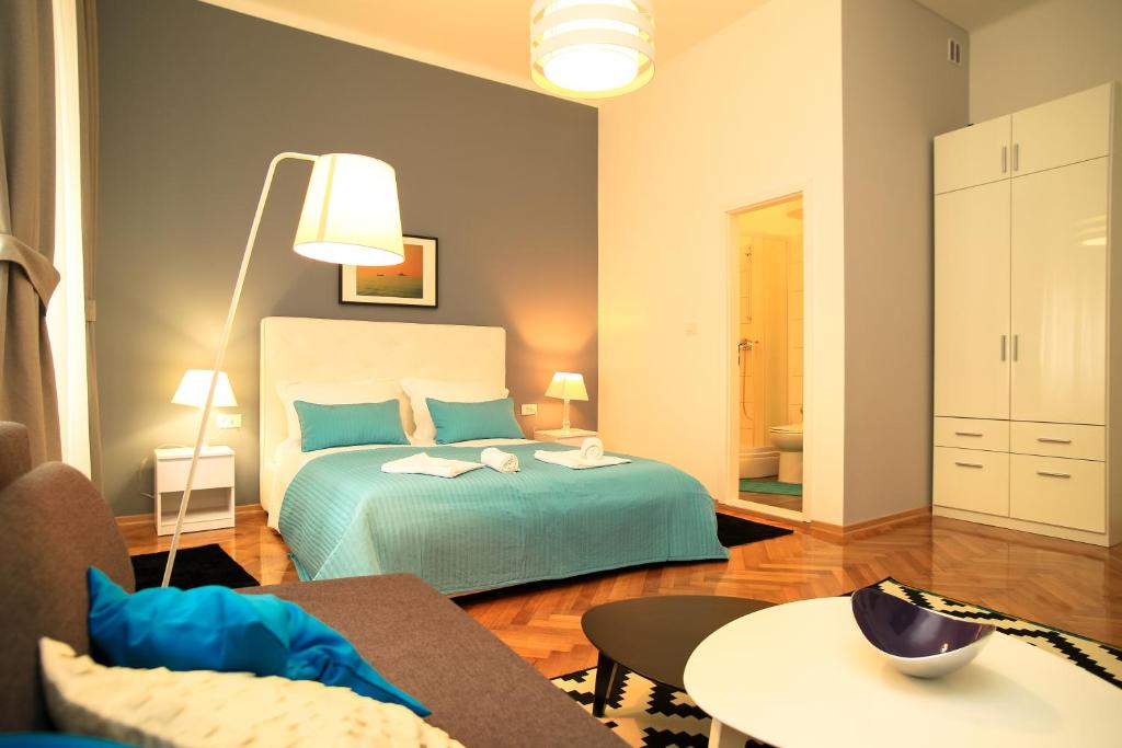 Postel nebo postele na pokoji v ubytování Contarini Luxury Rooms