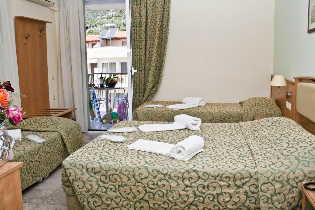 Postel nebo postele na pokoji v ubytování Tolon Holidays Hotel