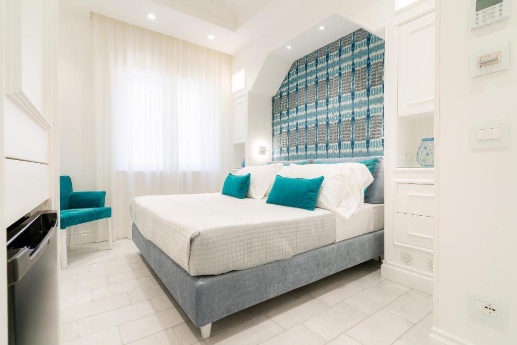 Postel nebo postele na pokoji v ubytování L'INCANTO DI CIOFFI ROOMS