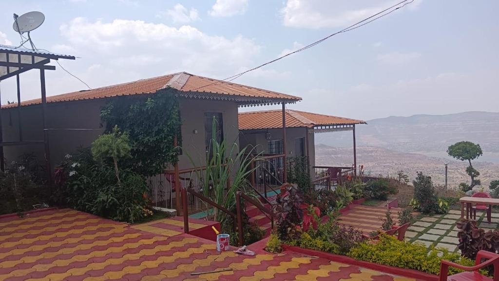 a house with a view of the mountains at KAASH PATHAR DREAM HOUSE in Satara