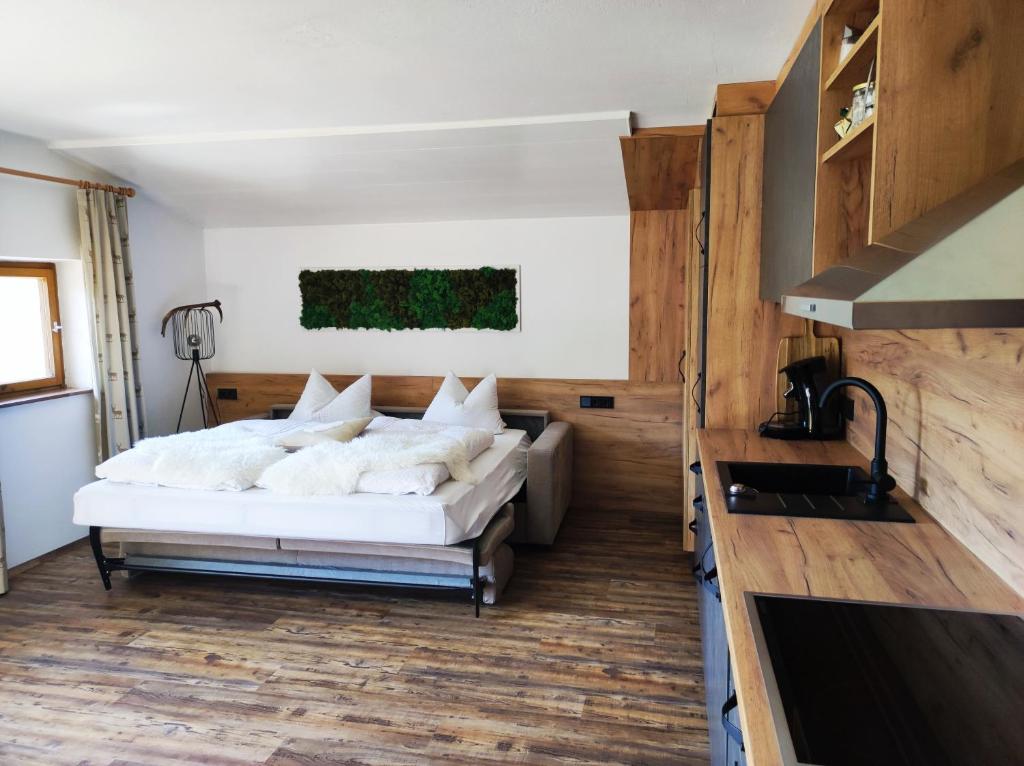 Postel nebo postele na pokoji v ubytování Haus Alpina