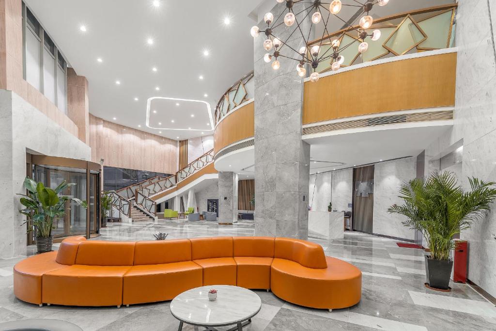 Posezení v ubytování Guangzhou Baiyun Airport Rejoice by Argyle Hotel Rehe Metro Exit B --Free shuttle bus is provided during the 137th Canton Fair