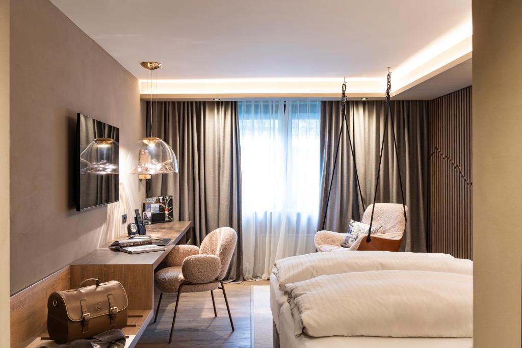 Posteľ alebo postele v izbe v ubytovaní Hotel Innsbruck