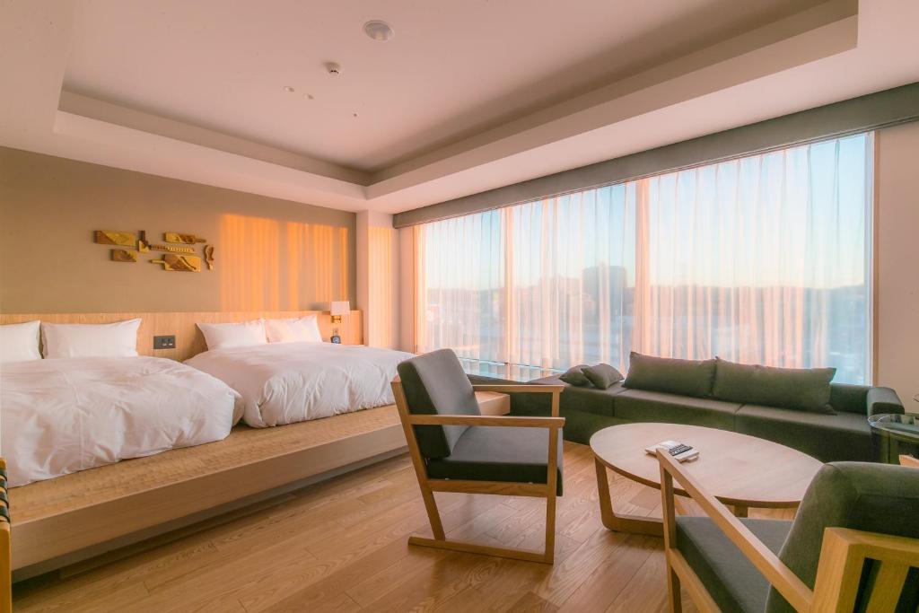 Postel nebo postele na pokoji v ubytování Spa & Hotel Suishun Matsuiyamate