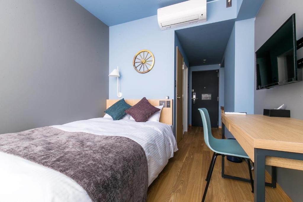 Postel nebo postele na pokoji v ubytování Spa & Hotel Suishun Matsuiyamate