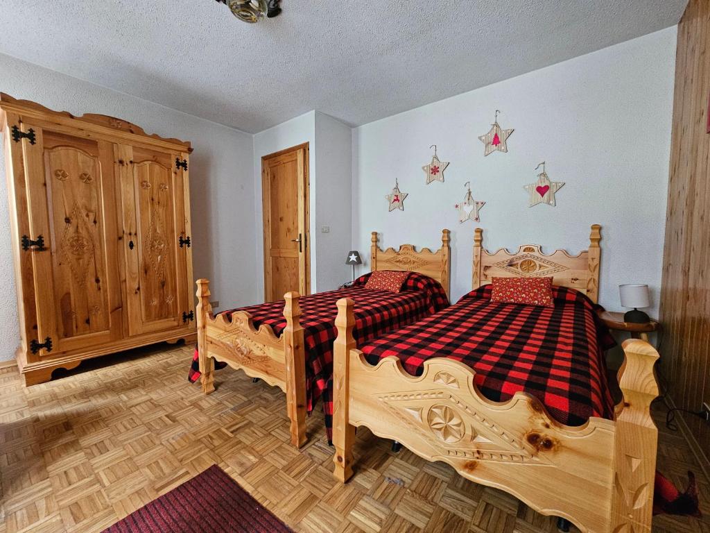 Postel nebo postele na pokoji v ubytování Appartamento panoramico La Chapelle