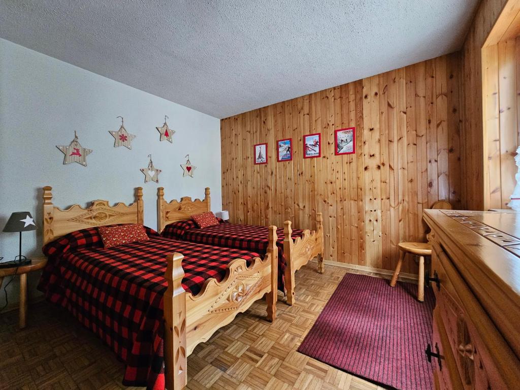 Postel nebo postele na pokoji v ubytování Appartamento panoramico La Chapelle