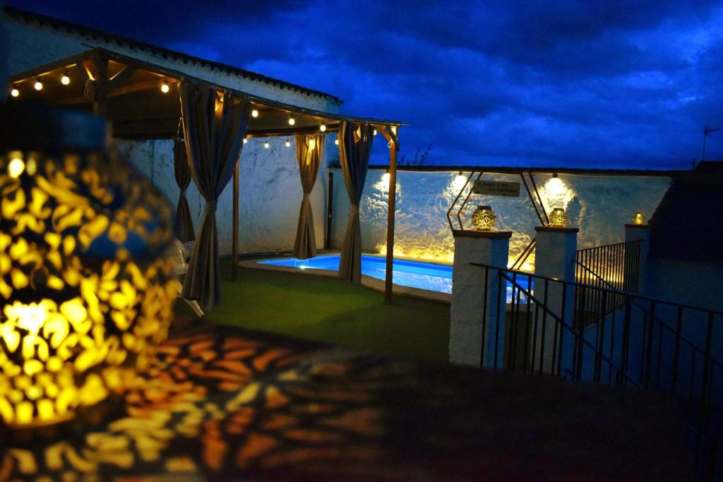 a bunch of bananas on a balcony at night at Aljibe Morisco - Casa Rural - in Hornachos
