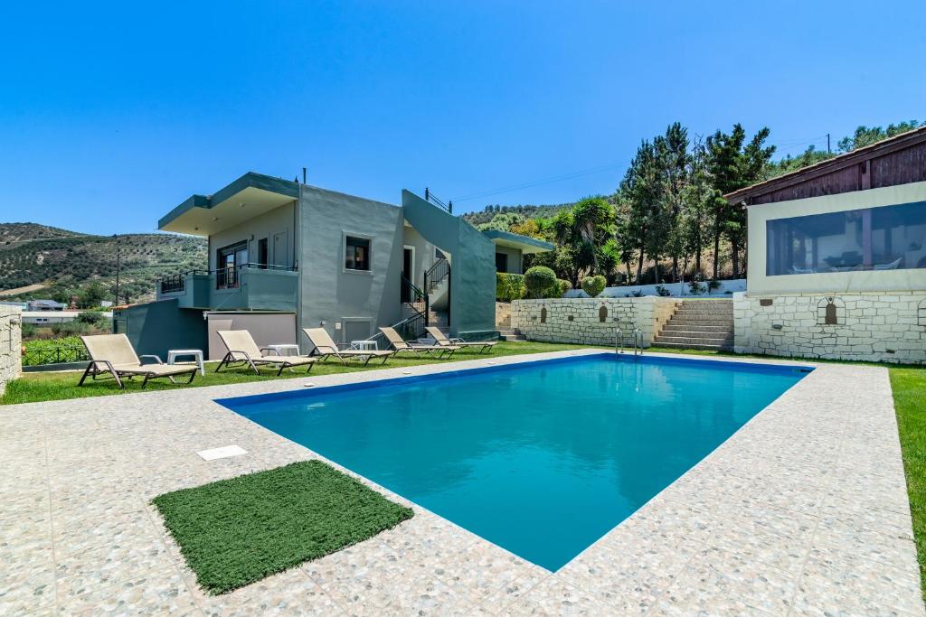 a swimming pool in the backyard of a house at House with Pool & Garden for Families & Friends 2 in Heraklio Town