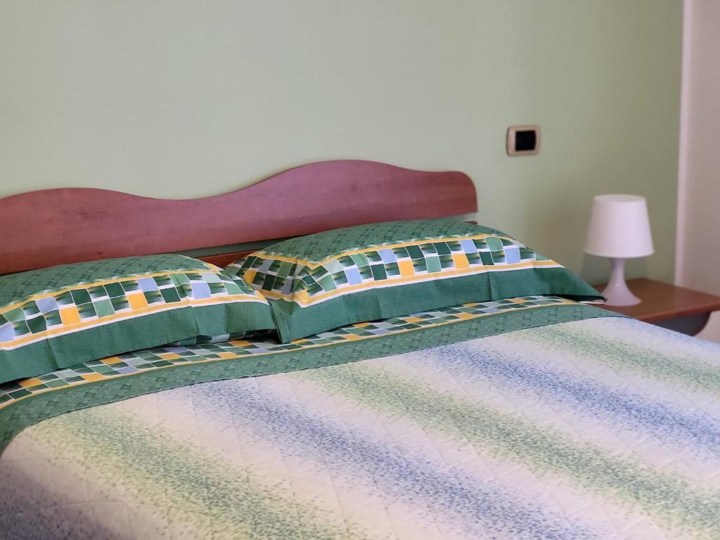 Кровать или кровати в номере COLLINA FIORITA