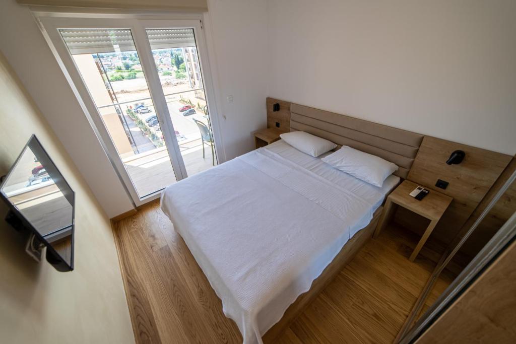Postel nebo postele na pokoji v ubytování Apart Kraft
