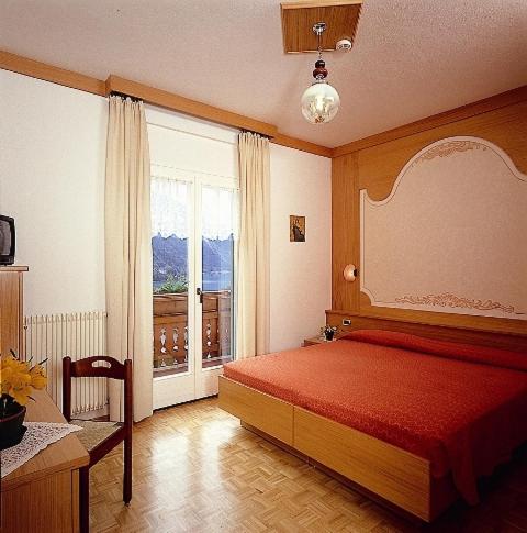Postel nebo postele na pokoji v ubytování Charme Hotel Nevada
