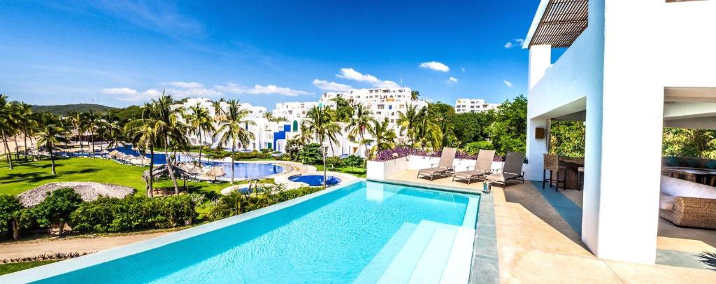 a view of the pool at a resort at 2029 - Villa Camino Real in Santa Cruz Huatulco