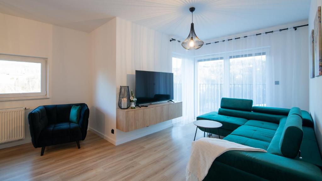 TV a/nebo společenská místnost v ubytování Apartament na Spokojnej