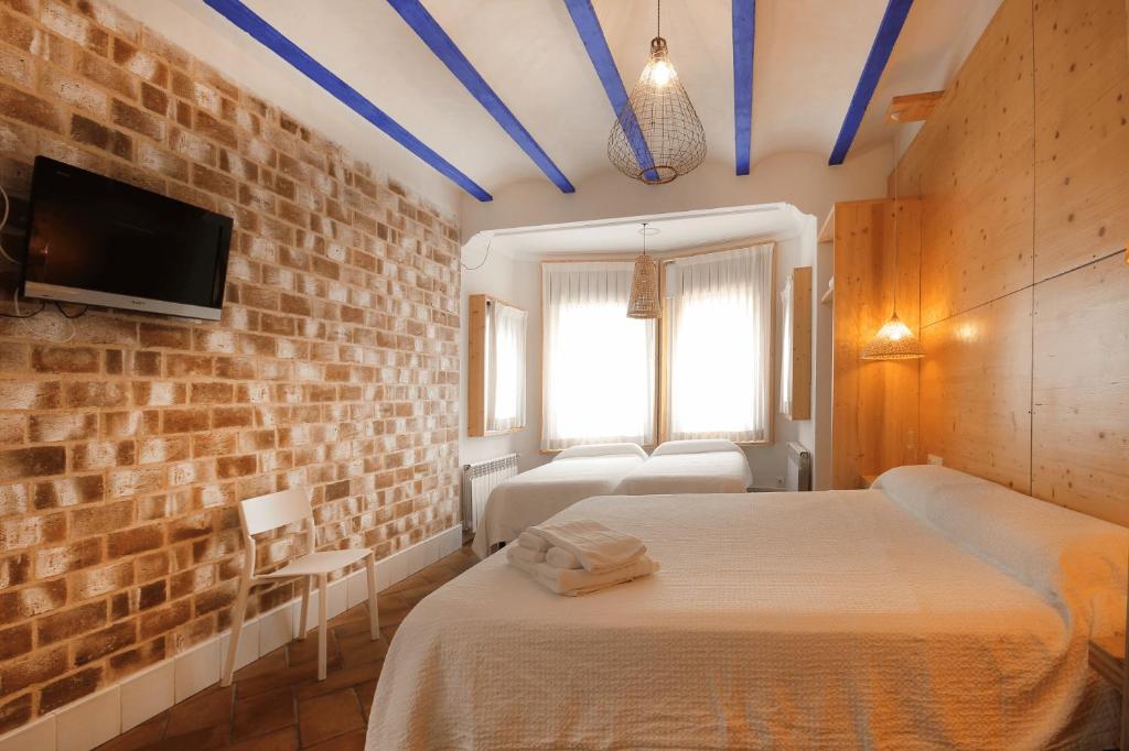 Postel nebo postele na pokoji v ubytování B&B Sant Pol - Adults Only