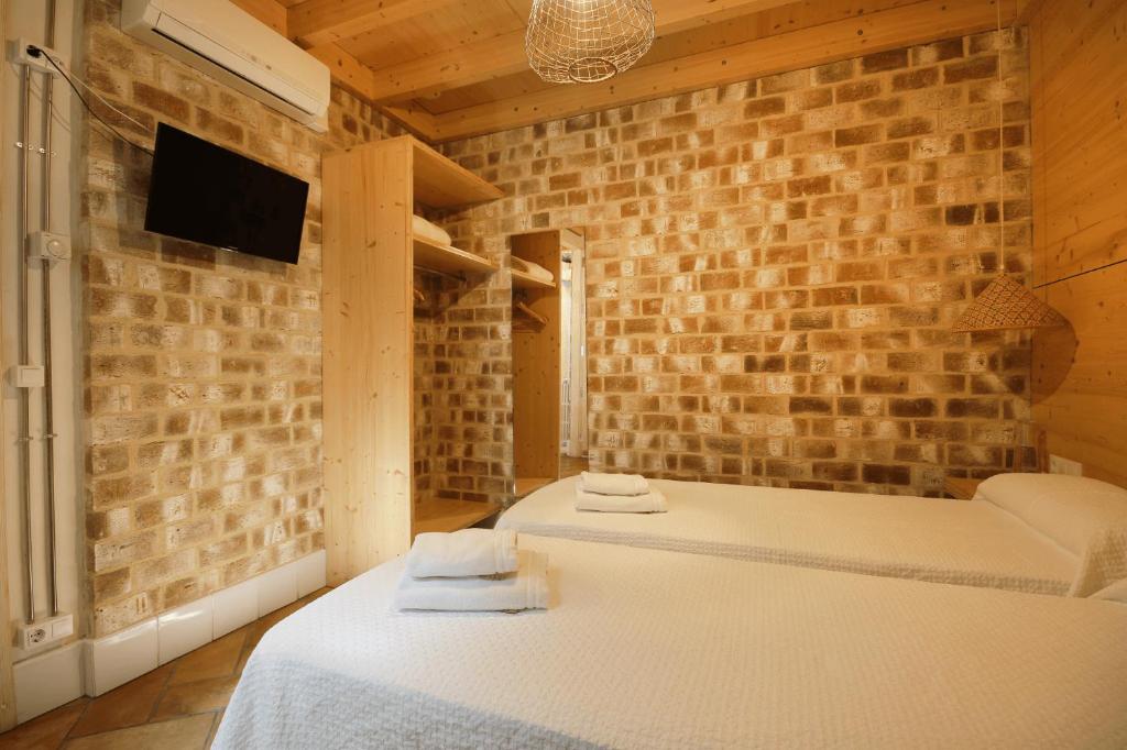Postel nebo postele na pokoji v ubytování B&B Sant Pol - Adults Only