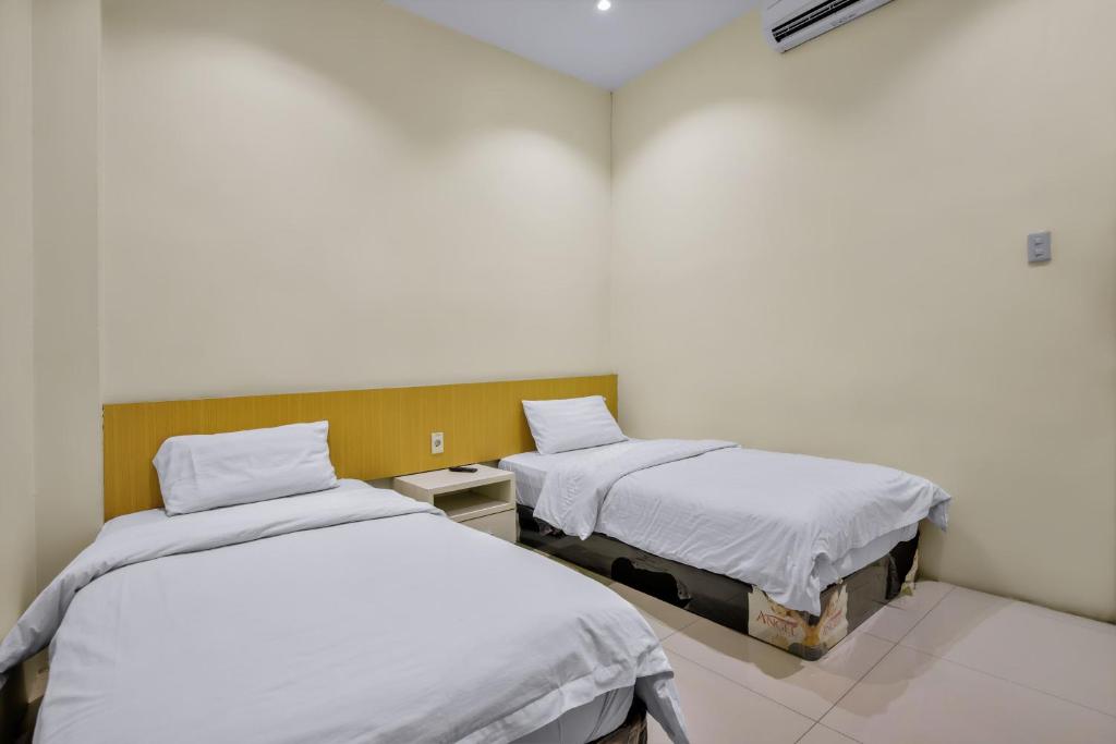Postel nebo postele na pokoji v ubytování Vivostay