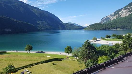 a view of a body of water with mountains at CHALET ARIANNA in Molveno