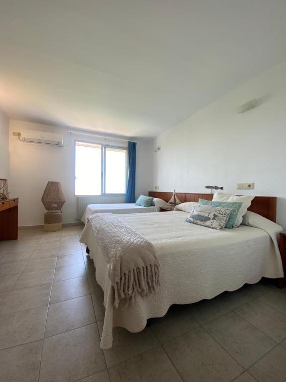 Postel nebo postele na pokoji v ubytování Hostal Blayet