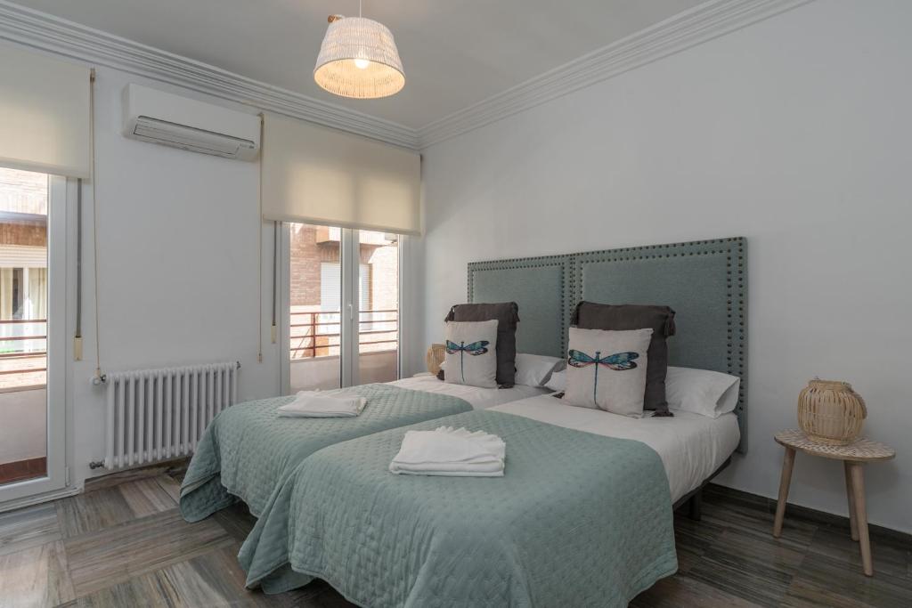 Postel nebo postele na pokoji v ubytování tuGuest Gran Vía 24 Apartment