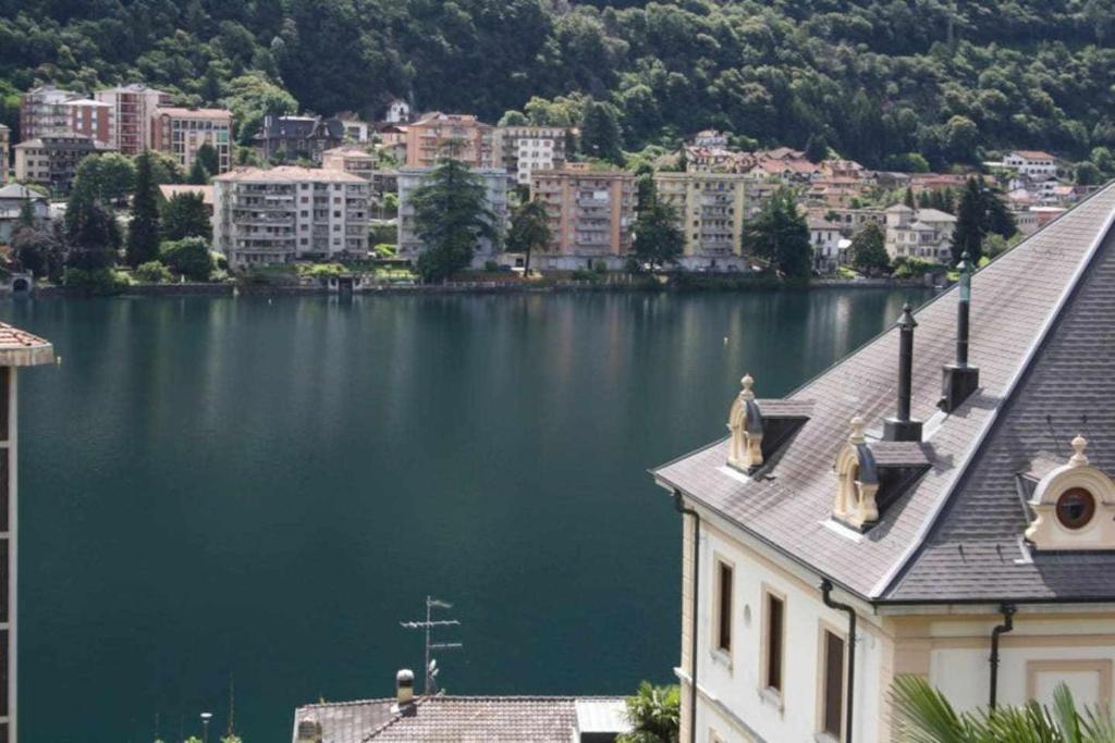 a view of a large body of water with buildings at Bluelake Apartament 1 Omegna in Omegna