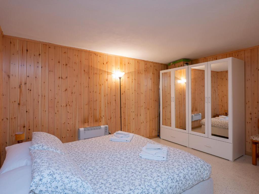 Posteľ alebo postele v izbe v ubytovaní I Host Apartment - Centrale 18 - Bormio