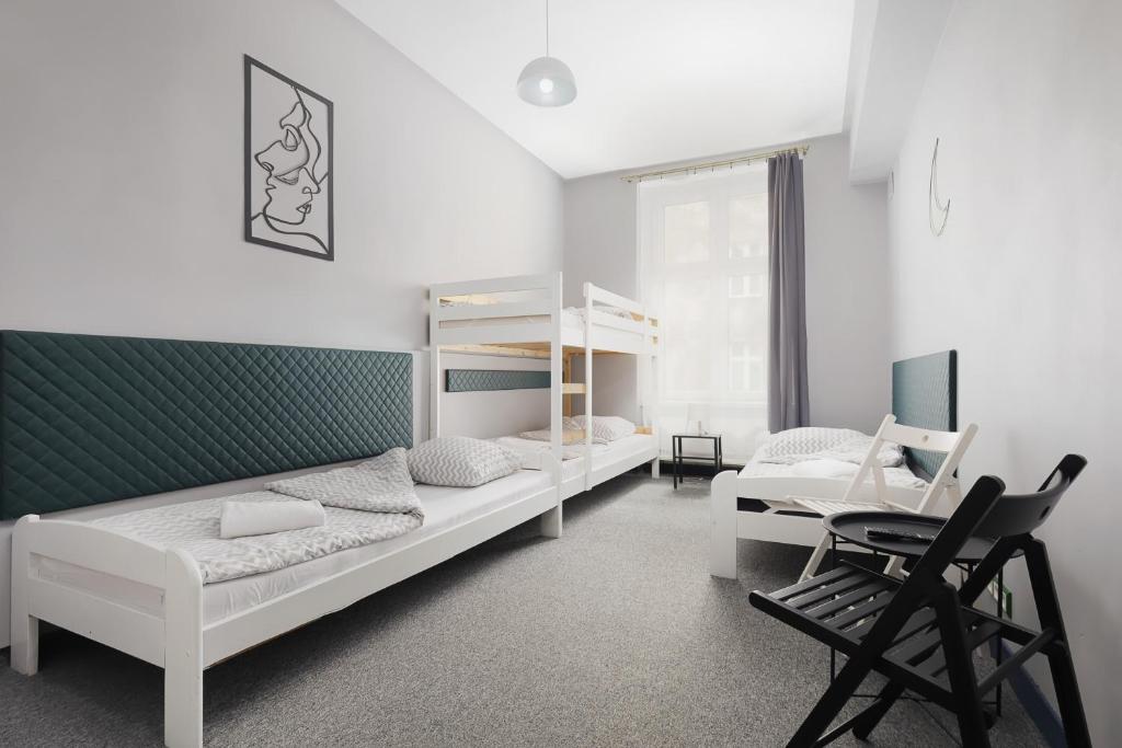 Posteľ alebo postele v izbe v ubytovaní Moon Hostel Kraków