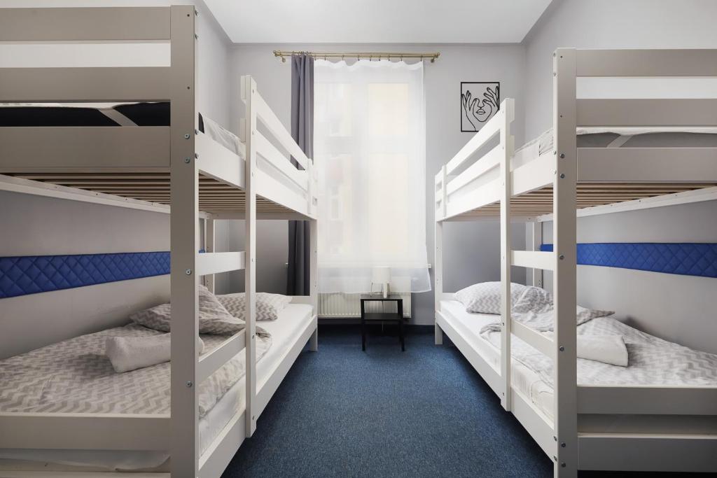 Posteľ alebo postele v izbe v ubytovaní Moon Hostel Kraków
