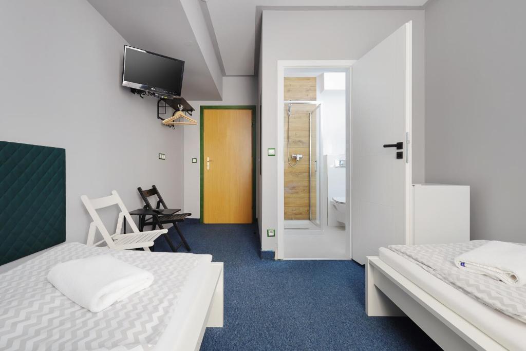 Posteľ alebo postele v izbe v ubytovaní Moon Hostel Kraków