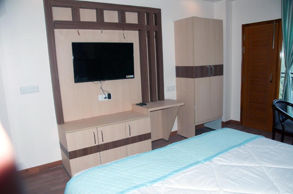 Postel nebo postele na pokoji v ubytování Summer Hill Resort