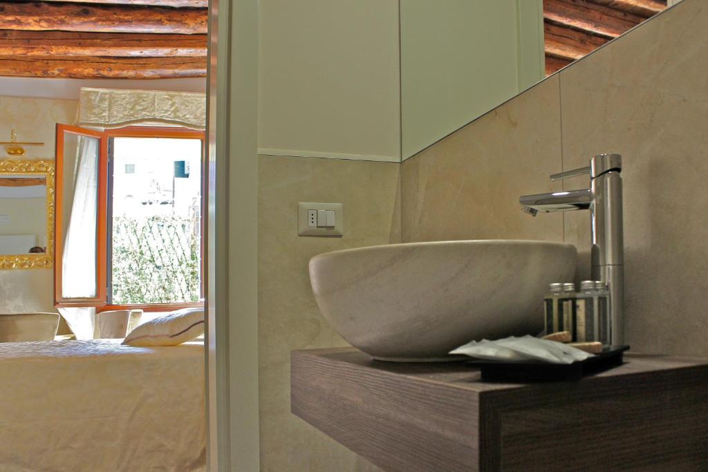Postel nebo postele na pokoji v ubytování B&B Patatina